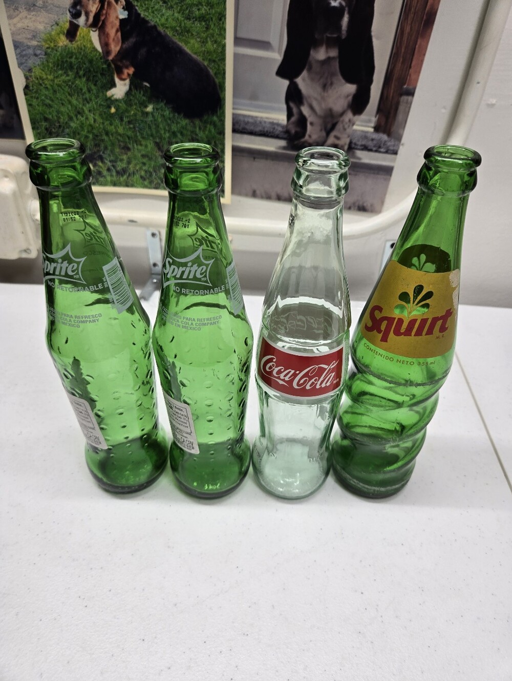 Four 12 Fl Oz Soda Bottles From Mexico. 2 Sprite, 1 Coke, & 1 Squirt. Rare Nice